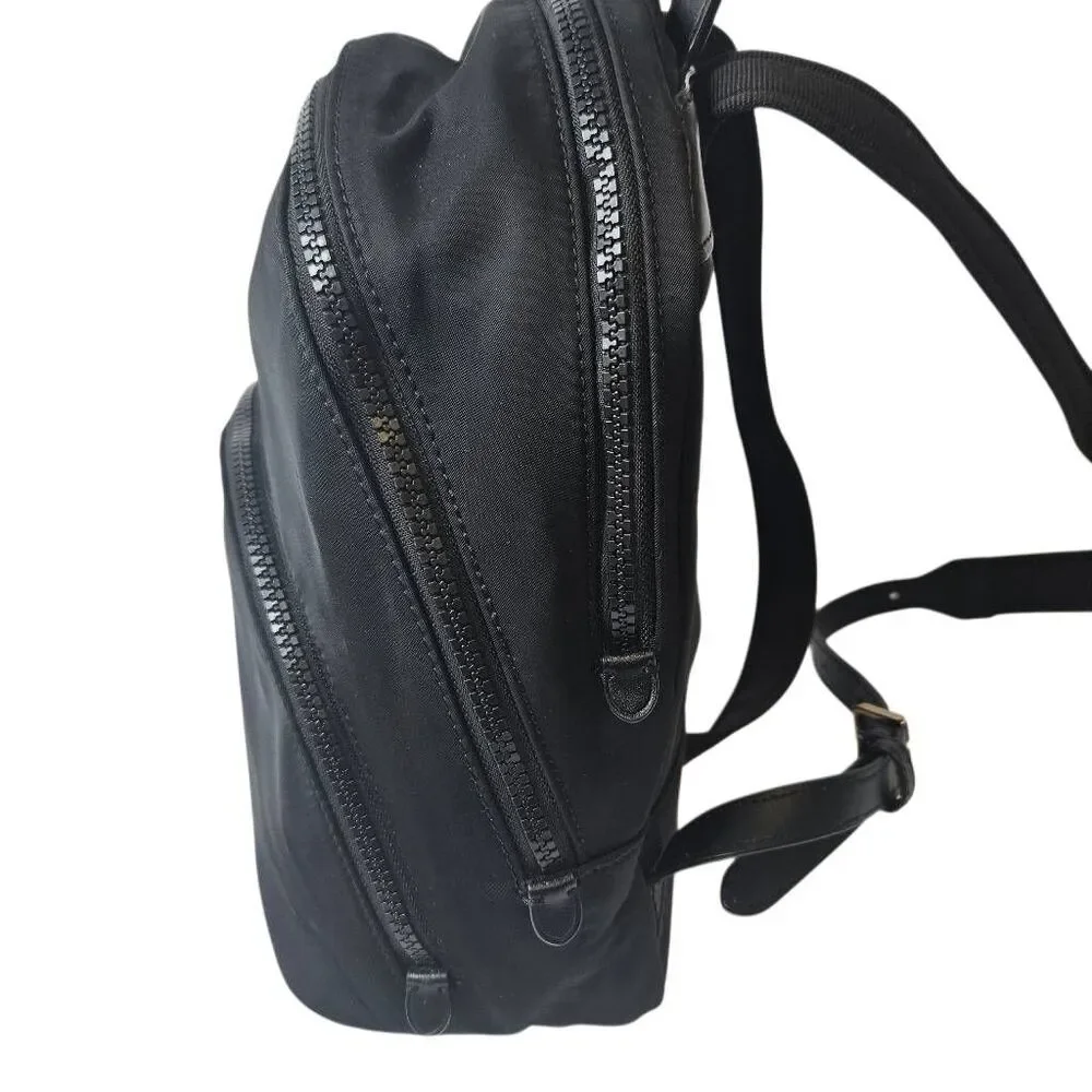Kate Spade Karissa black nylon backpack, minimalist design.
